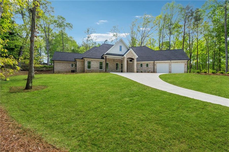 Front exterior of a new home in , Gainesville, GA, highlighting curb appeal (Image 1). Front exterior of a new home in , Gainesville, GA, highlighting curb appeal (Image 1).