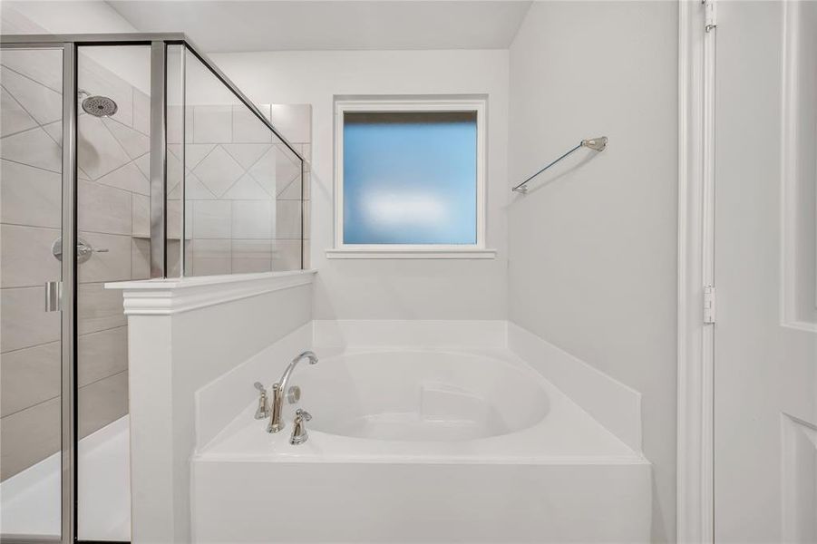 Bathroom with a garden tub and a shower stall Bathroom with a garden tub and a shower stall