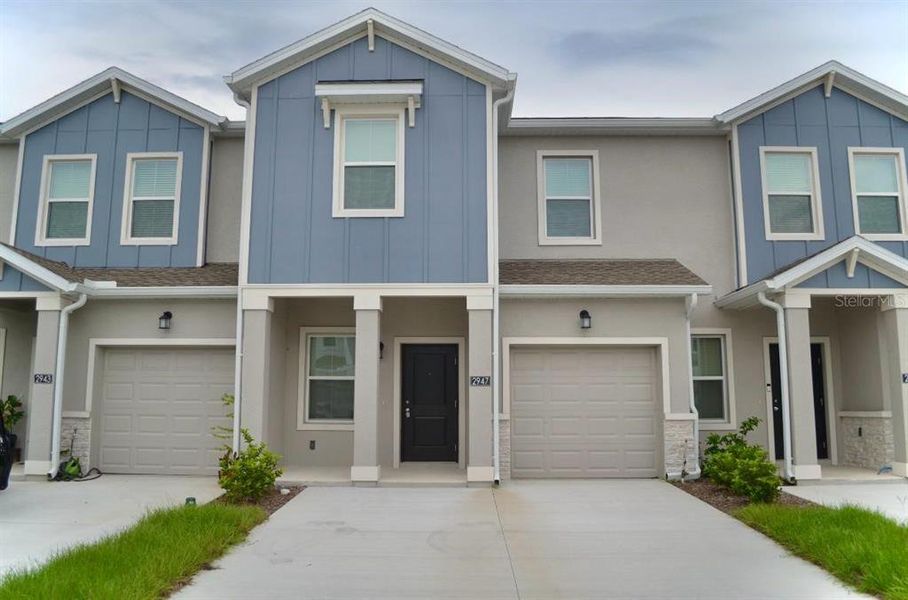 Front exterior of a new home in , Davenport, FL, highlighting curb appeal (Image 1). Front exterior of a new home in , Davenport, FL, highlighting curb appeal (Image 1).