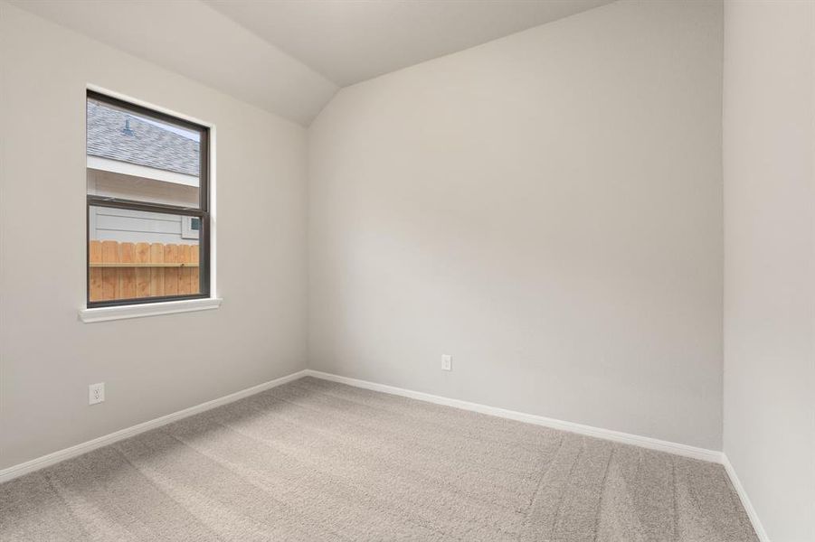 Your secondary bedroom features plush carpet, fresh paint, closet, and a large window that lets in plenty of natural lighting.