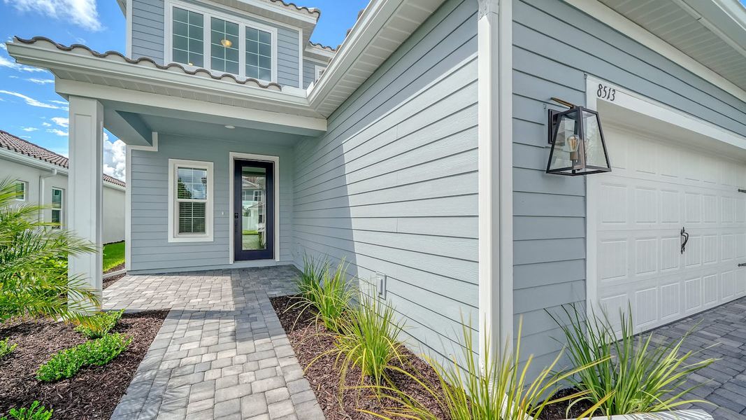 Exterior details and patio area of a home in Windward Real Estate and Homes for Sale in Sarasota, FL - Neal Communities, Lakewood Ranch (Image 3).