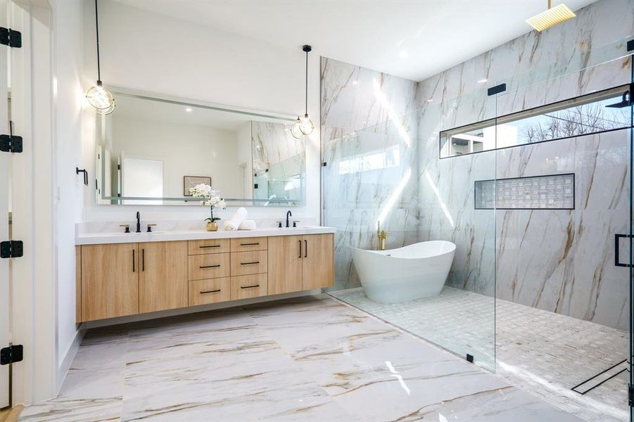 Bathroom with vanity and shower with separate bathtub