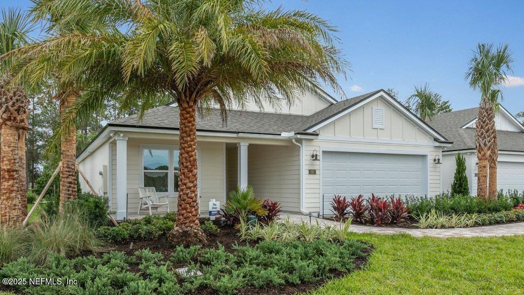 Front exterior of a new home in American Village, Palm Coast, FL, highlighting curb appeal (Image 18).