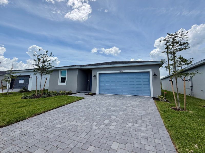 Front exterior of a new home in Hampton Park - Classic Series, Vero Beach, FL, highlighting curb appeal (Image 10).