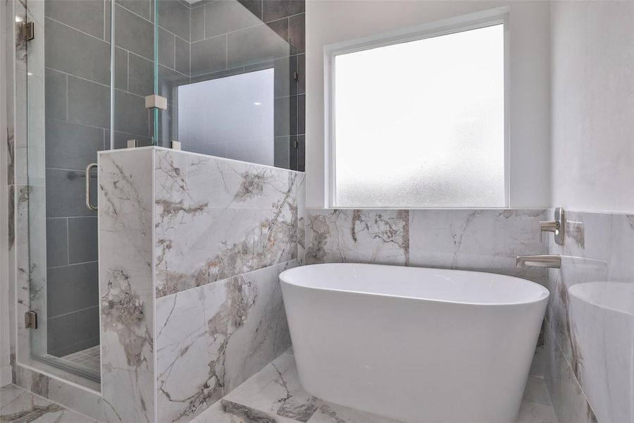 Unwind in the luxurious soaker tub, perfect for relaxing after a long day.