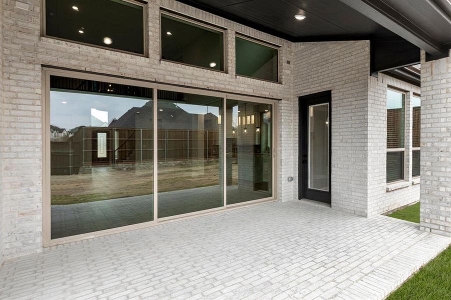 Exterior details and patio area of a home in Cambridge Estates - Harwood, Prosper (Image 3).