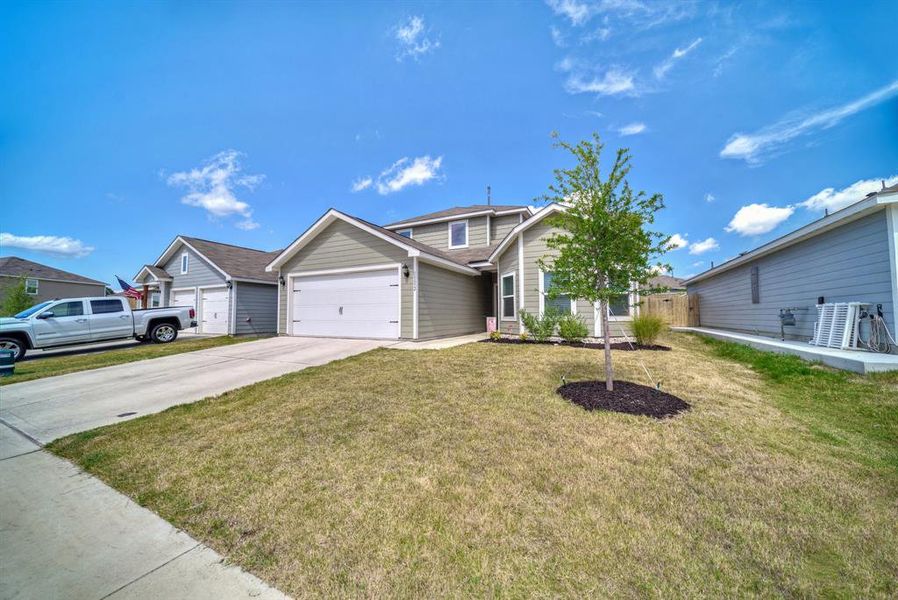Front exterior of a new home in Vista West, Fort Worth, TX, highlighting curb appeal (Image 1).