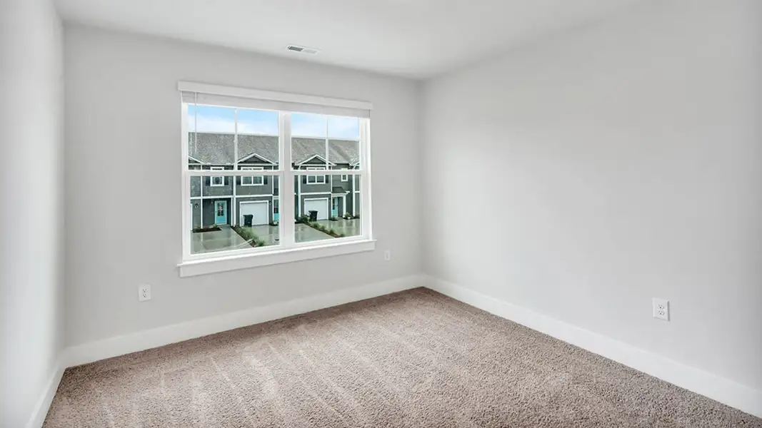 Spacious, unfurnished interior of a new home in The Townes at Cedar Hill Landing, Navassa (Image 28).