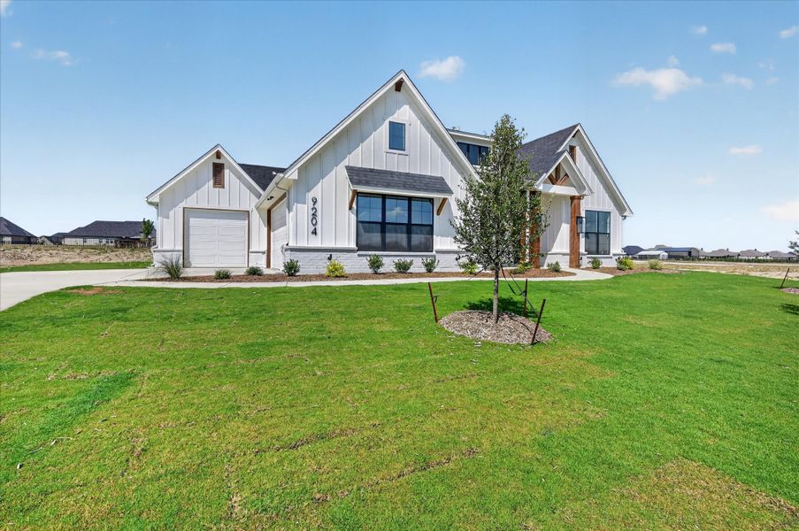 Front exterior of a new home in Paloma Ranches, Justin, TX, highlighting curb appeal (Image 2). Front exterior of a new home in Paloma Ranches, Justin, TX, highlighting curb appeal (Image 2).