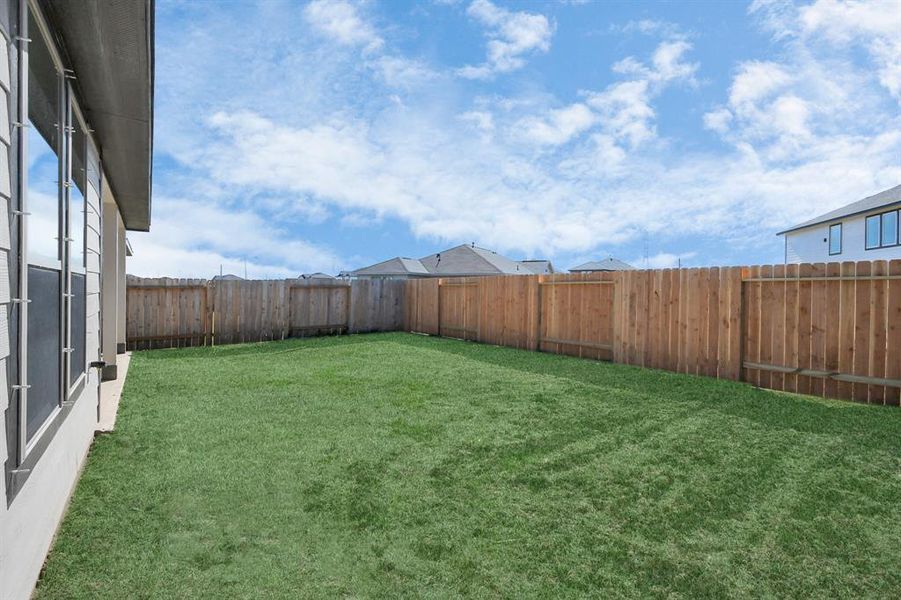 Come and see this spacious backyard with its beautiful covered patio. There is plenty ofroom for the kids to play and adults to relax. Perfect for your outdoor living space, patiofurniture, bbq pit, and so much more. The possibilities are endless!