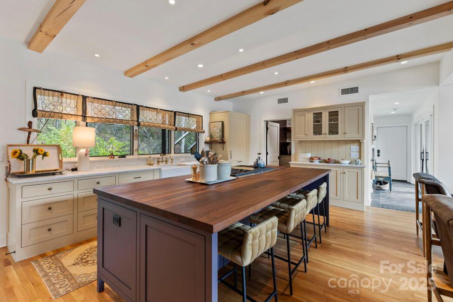 Open Kitchen with Walnut Countertops on Breakfast Island