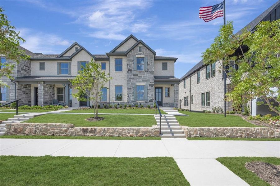 Multi-level facade featuring stone and stucco finishes Multi-level facade featuring stone and stucco finishes