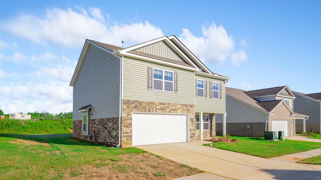 Front exterior of a new home in Price's Crossing, LaFayette, GA, highlighting curb appeal (Image 20). Front exterior of a new home in Price's Crossing, LaFayette, GA, highlighting curb appeal (Image 20).