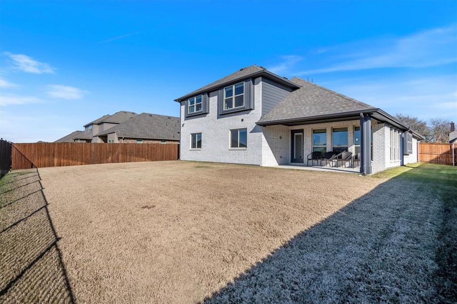 Exterior details and patio area of a home in The Grove, Midlothian (Image 24).