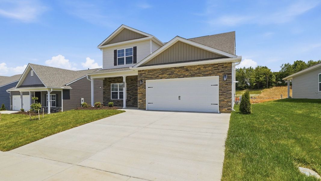 Front exterior of a new home in Keebler Meadows, Johnson City, TN, highlighting curb appeal (Image 2). Front exterior of a new home in Keebler Meadows, Johnson City, TN, highlighting curb appeal (Image 2).