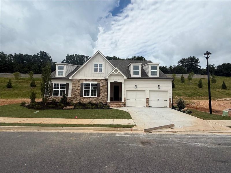 Front exterior of a new home in , Canton, GA, highlighting curb appeal (Image 10).