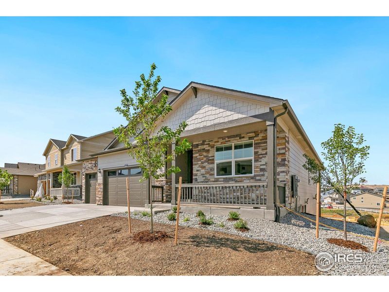 Front exterior of a new home in Lakeside Canyon, Mead, CO, highlighting curb appeal (Image 20).