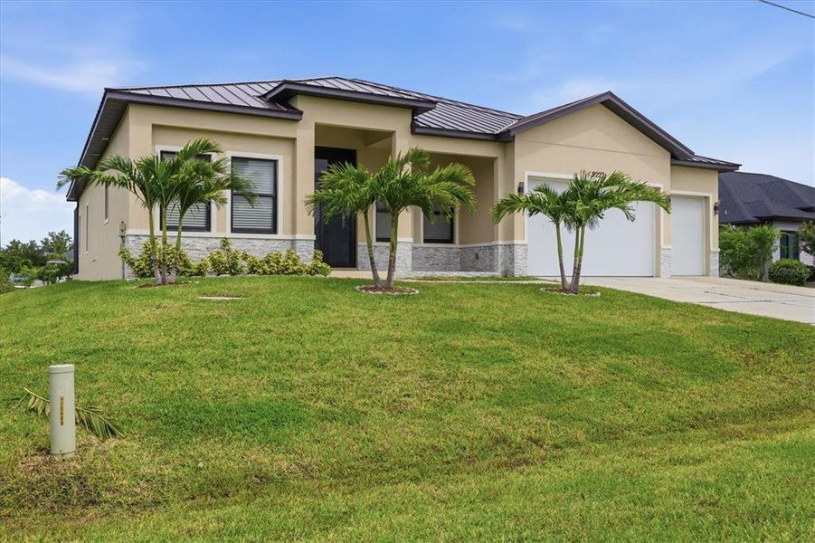Front exterior of a new home in , Port Charlotte, FL, highlighting curb appeal (Image 2). Front exterior of a new home in , Port Charlotte, FL, highlighting curb appeal (Image 2).