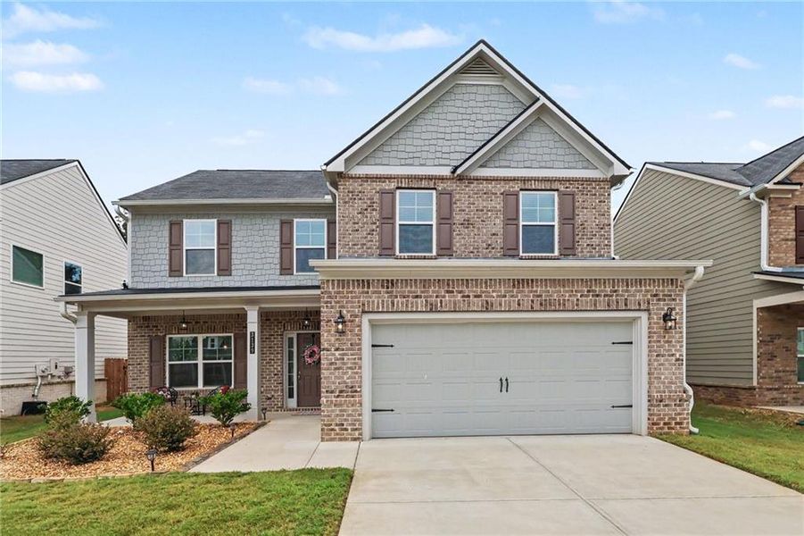 Front exterior of a new home in Old Lost Mountain Estates, Powder Springs, GA, highlighting curb appeal (Image 21).