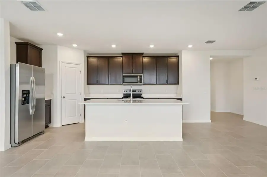 Furnished interior view inside a new home in Wynnstone - Signature Series, Davenport (Image 5).