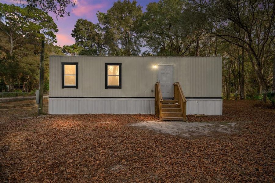 Exterior details and patio area of a home in , Summerfield (Image 24).