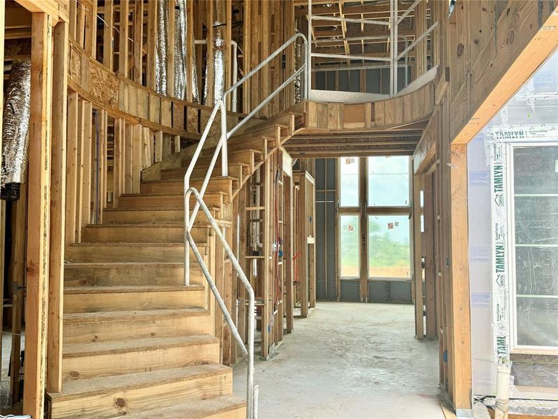 CURVED STAIRCASE - SLIDING DOOR GOING OUT TO CENTER COURTYARD