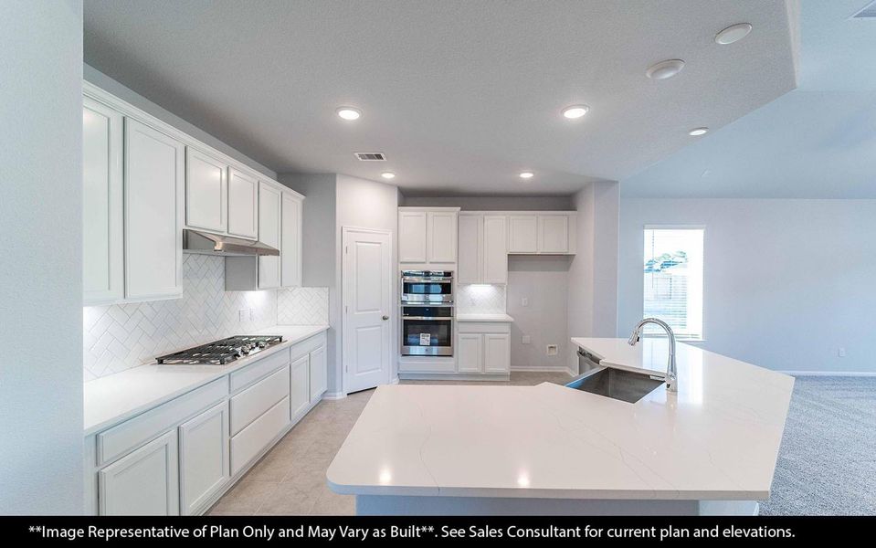 The heart of the home—this beautiful open kitchen welcomes gatherings with its bright, inviting layout. Featuring wood-like vinyl floors that look just like real wood but without the upkeep! Perfect for cooking, entertaining, or enjoying a casual meal with loved ones.   All built in appliances, granite countertops and more!  **Image Representative of Plan Only and May Vary as Built**.