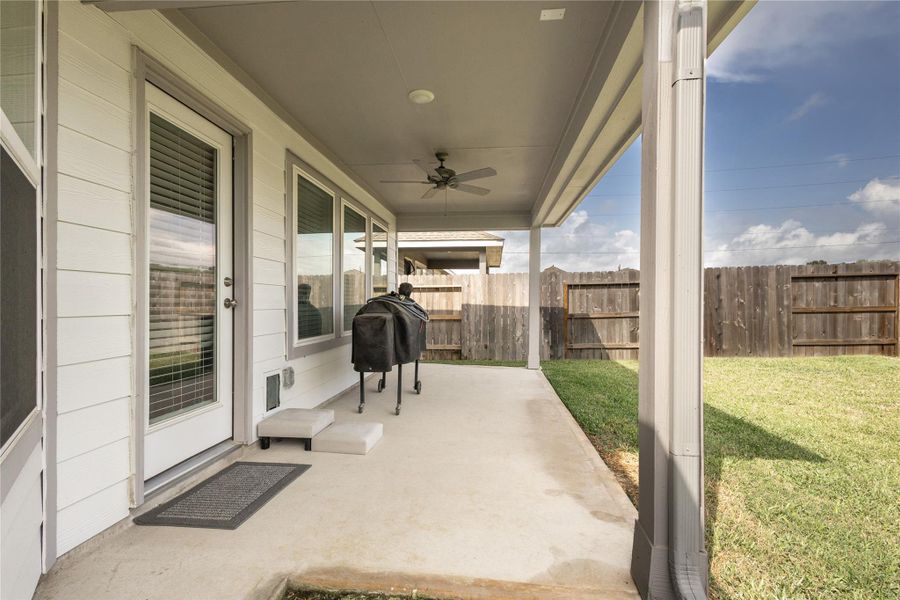 Exterior details and patio area of a home in Pinewood at Grand Texas, New Caney (Image 25).