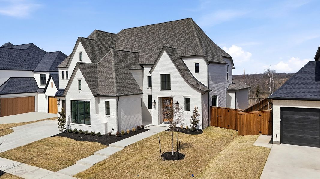 Front exterior of a new home in Light Farms Graham/Reagan, Celina, TX, highlighting curb appeal (Image 27).