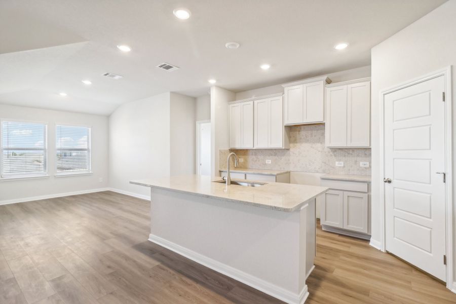 Kitchen in the Briscoe floorplan at a Meritage Homes community.