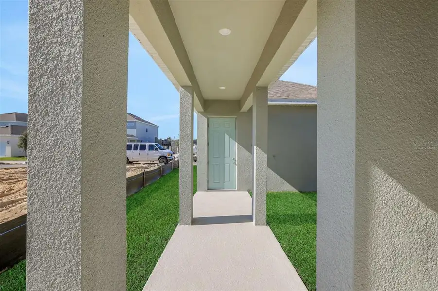 Exterior details and patio area of a home in Crossroads at Kelly Park, Apopka (Image 4).
