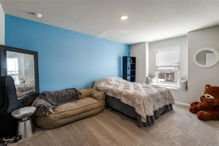 Carpeted bedroom with baseboards