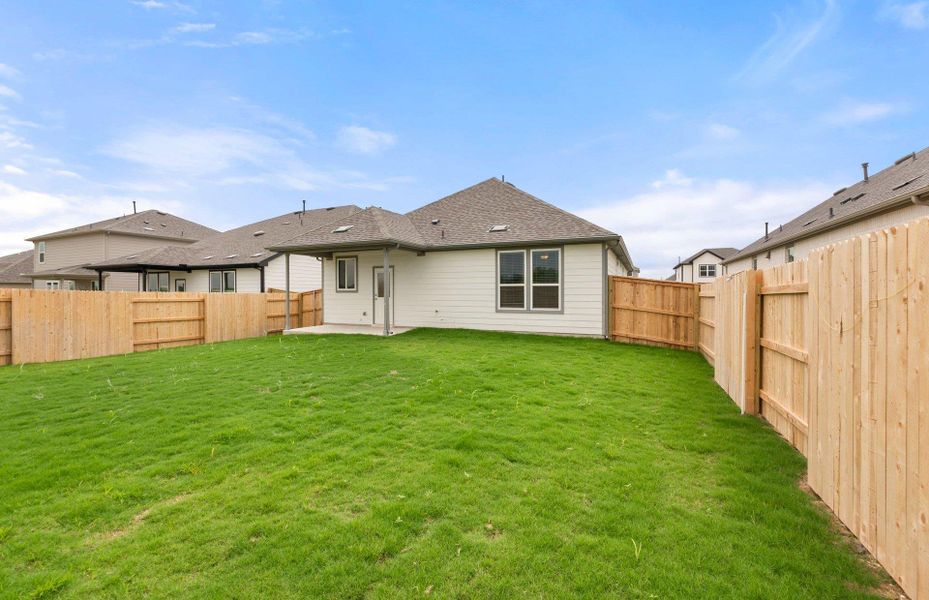Front exterior of a new home in Patterson Ranch, Georgetown, TX, highlighting curb appeal (Image 27). Front exterior of a new home in Patterson Ranch, Georgetown, TX, highlighting curb appeal (Image 27).