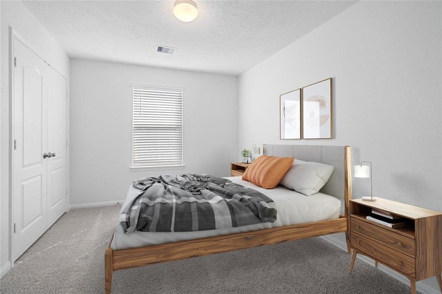 Secondary bedroom features plush carpet, neutral paint, lighting, large window with privacy blinds and ample sized closet space.