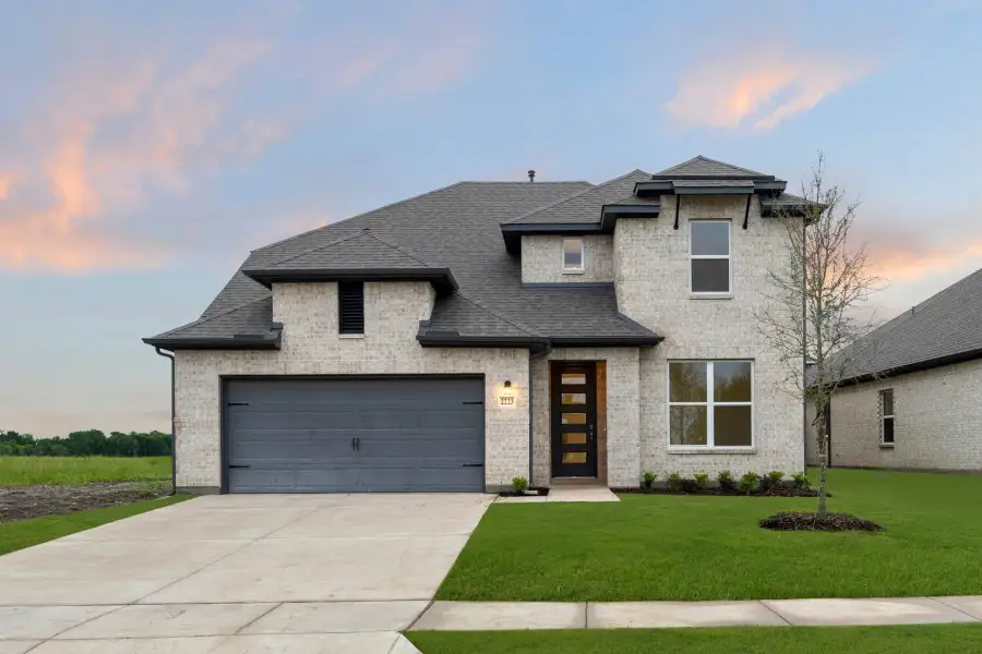 Representative exterior photo of a completed home built from the Freedom by Rockwell Homes in Walden Pond, Forney, TX (Image 24).