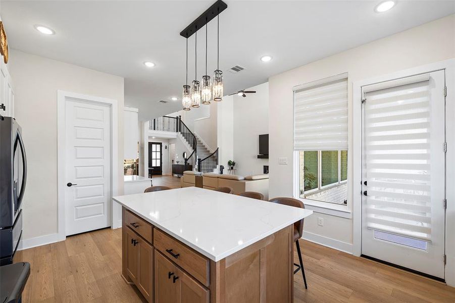 Looking out from the kitchen sink, there's the walk-in pantry to your left and the door to the covered patio on the right.