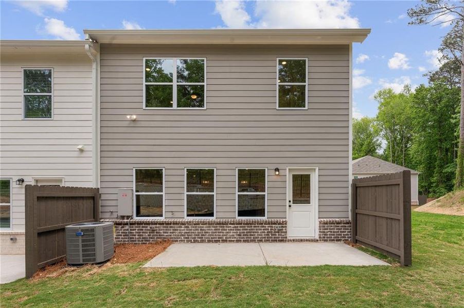 Exterior details and patio area of a home in River Walk Place, Lawrenceville (Image 21).