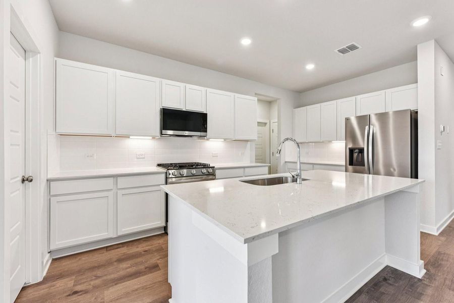 Furnished interior view inside a new home in Stallion Run, Buda (Image 7).