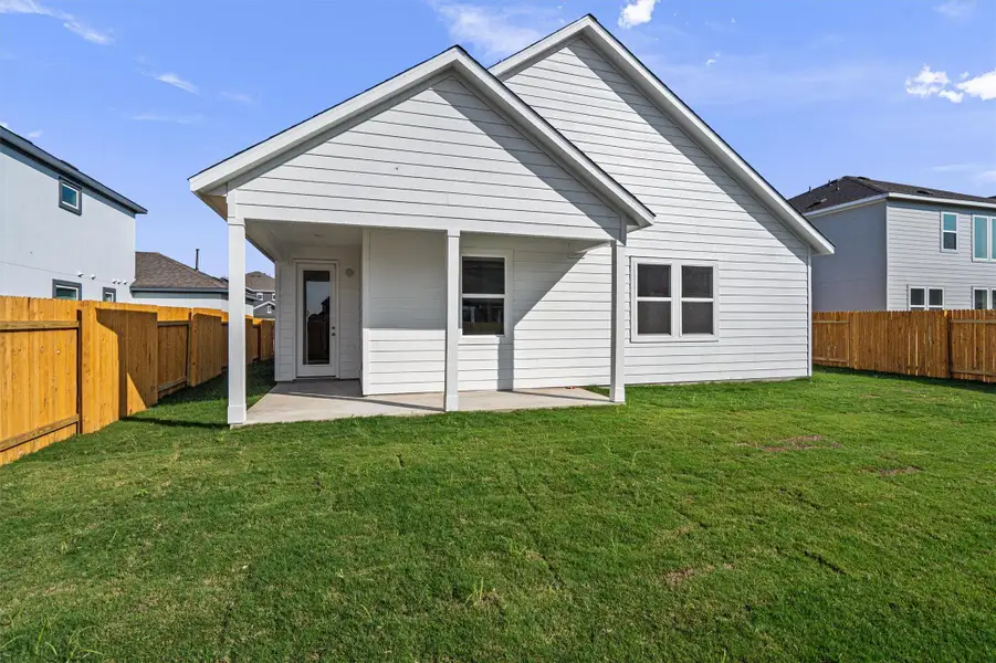 Front exterior of a new home in , Pflugerville, TX, highlighting curb appeal (Image 2).