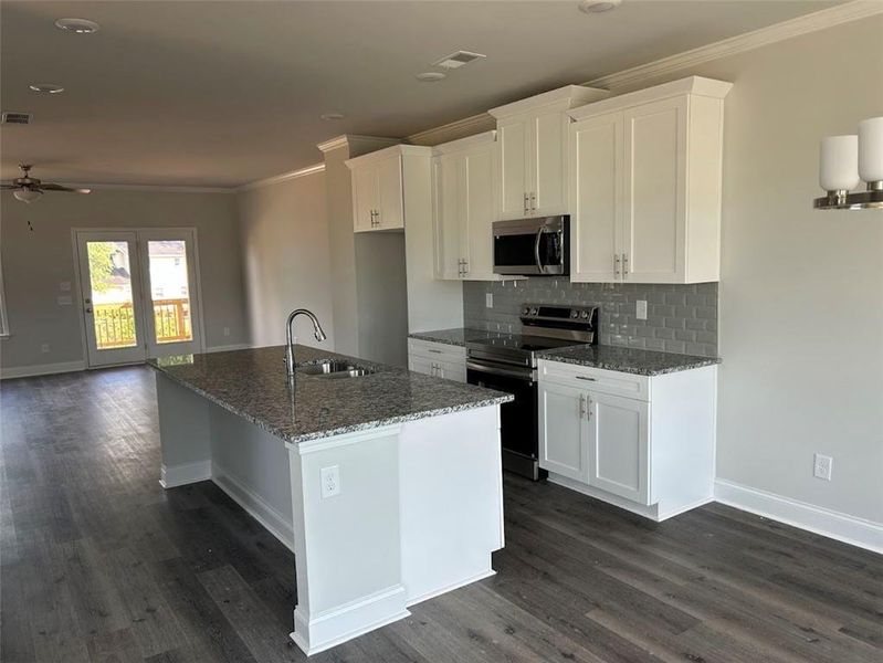 Furnished interior view inside a new home in Towns at Enclave, Lawrenceville (Image 9). Furnished interior view inside a new home in Towns at Enclave, Lawrenceville (Image 9).