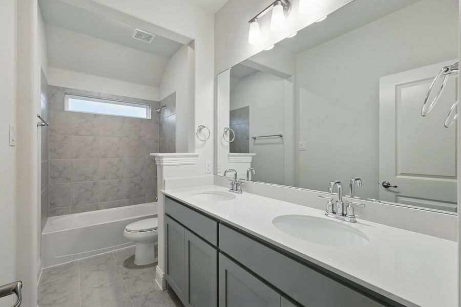 Representative furnished interior of a home built from the Classic Series - Dartmouth by DRB Homes in Oaks at San Gabriel, Georgetown (Image 18).