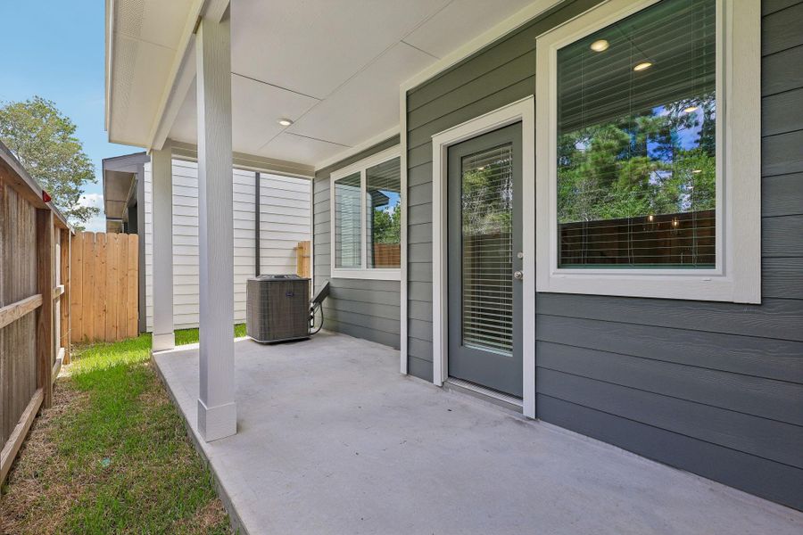 Exterior details and patio area of a home in Pinewood Trails - City Series, Atascocita (Image 3).