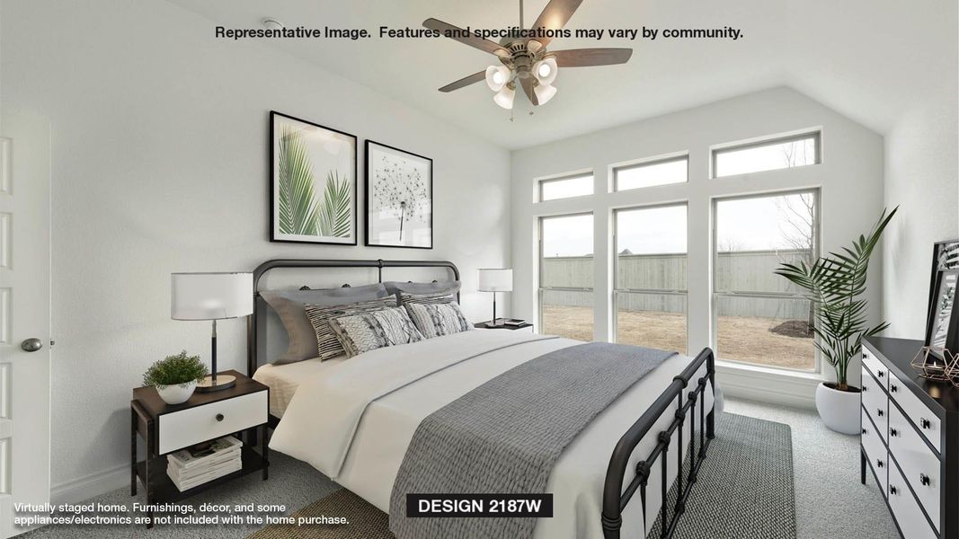 Bedroom featuring ceiling fan, multiple windows, lofted ceiling, and carpet floors