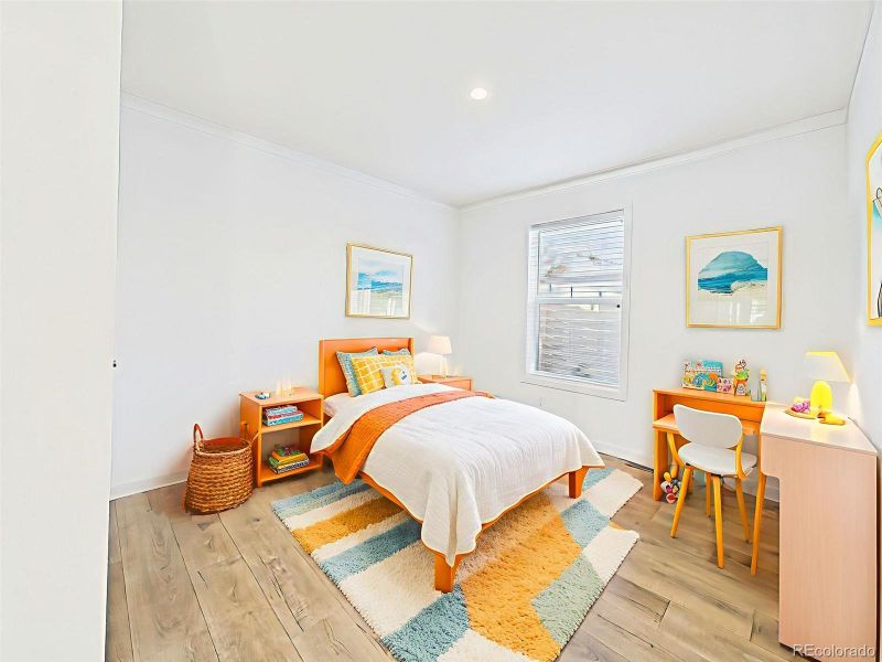 Bedroom #2 Virtually Staged Spacious third bedroom with large closet and staged for comfort with sunny, playful accents.