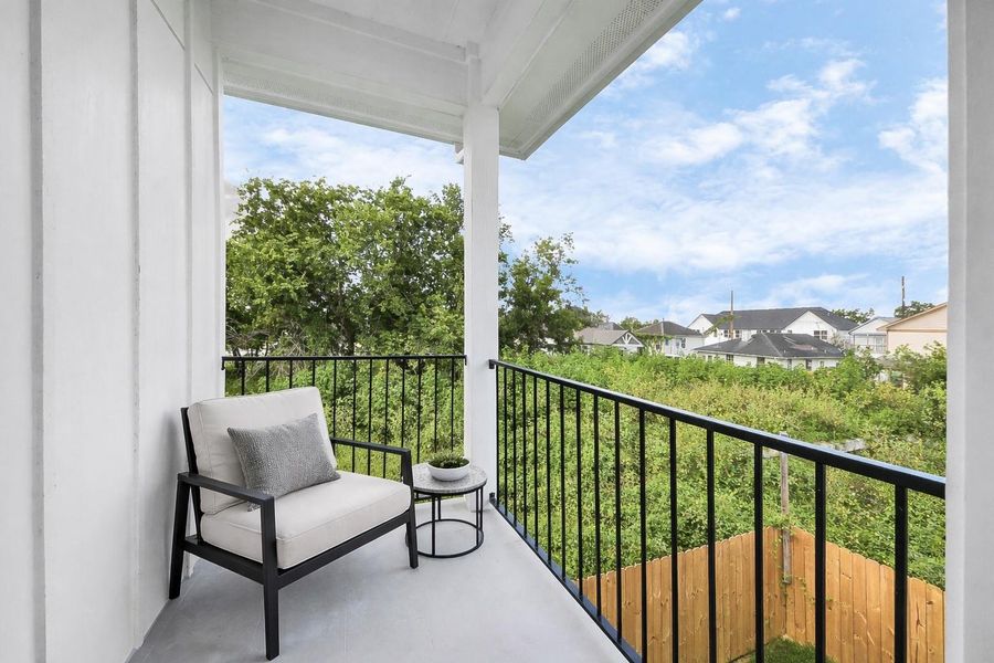 Private balcony off the primary suite offers a peaceful outdoor retreat with skyline views of Downtown Houston. Perfect for morning coffee or evening relaxation, combining comfort with city convenience.