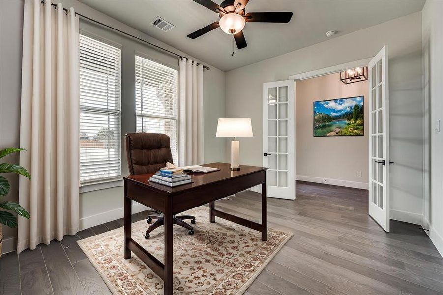 Office featuring french doors, baseboards, and dark wood finished floors