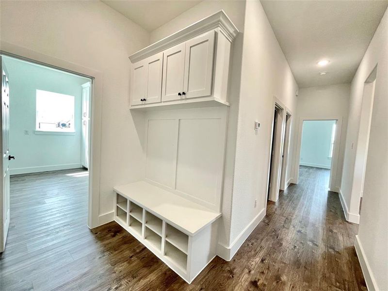 Mudroom with baseboards and dark wood-style flooring Mudroom with baseboards and dark wood-style flooring