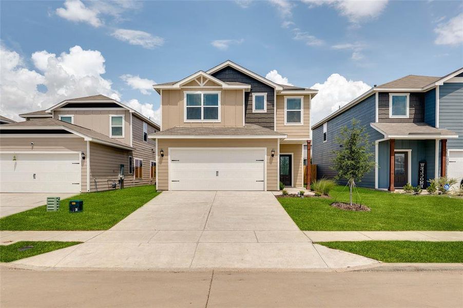 Craftsman house featuring a front lawn, concrete driveway, a garage, and roof with shingles