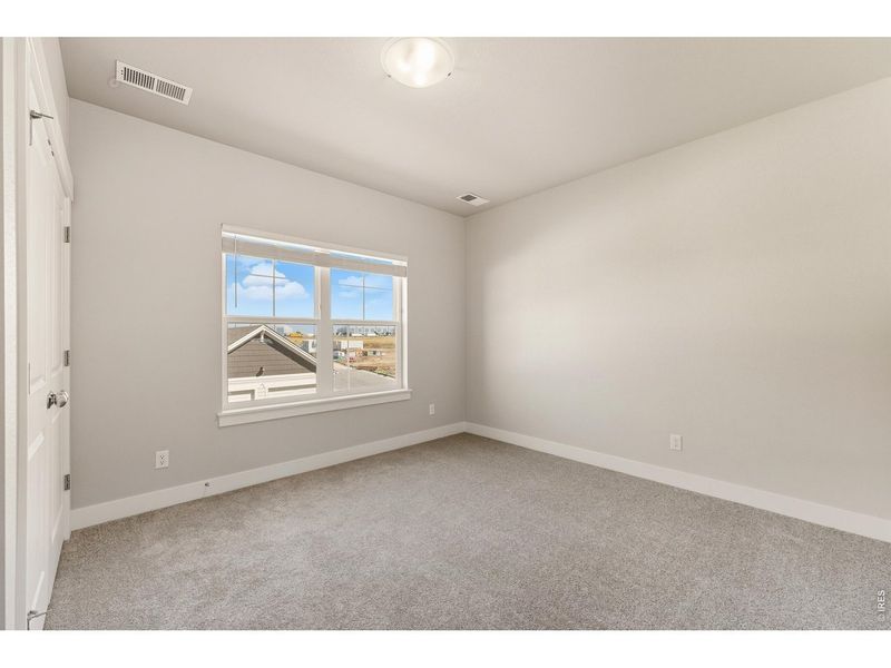 Spacious, unfurnished interior of a new home in The Lakes at Centerra - North Shore Flats, Loveland (Image 14).
