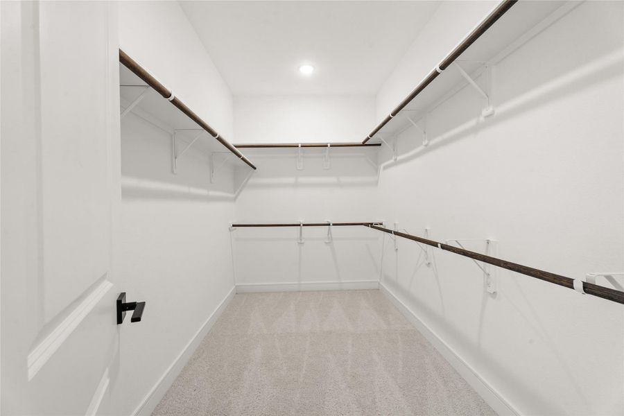 Primary walk-in closet (*Photo not of actual home and used for illustration purposes only.)